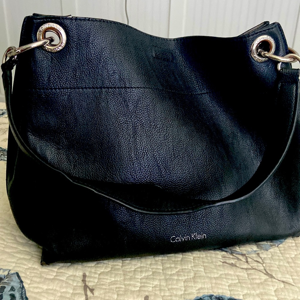 Large black leather bucket bag. Can be reversible to taupe. Lightweight/durable.